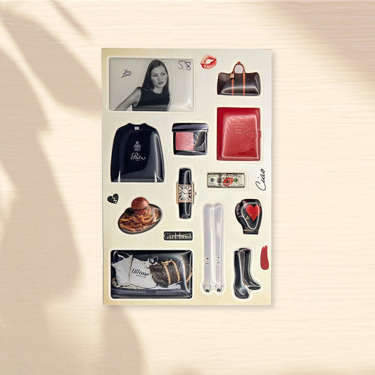 Glossy 3D domed sticker pack from GRLS, Stylish images - skis, boots, a boxing glove with a heart, a burger, money, a notepad, a sweater, a car trunk with fashionable bags, a luxury bag and watch, a vintage photo of a model, the inscriptions "Ciao" and "Girl Boss"