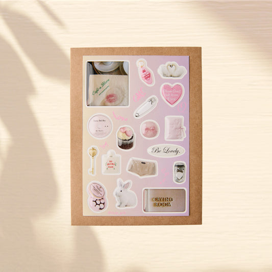 Set of premium 3d domed stickers on a beige background. Glossy images of a cafe, a fluffy bunny, white swans, a bottle with the inscription "No Drama Club," the inscription "Crying Room," a golden key, a hairpin, and a heart.